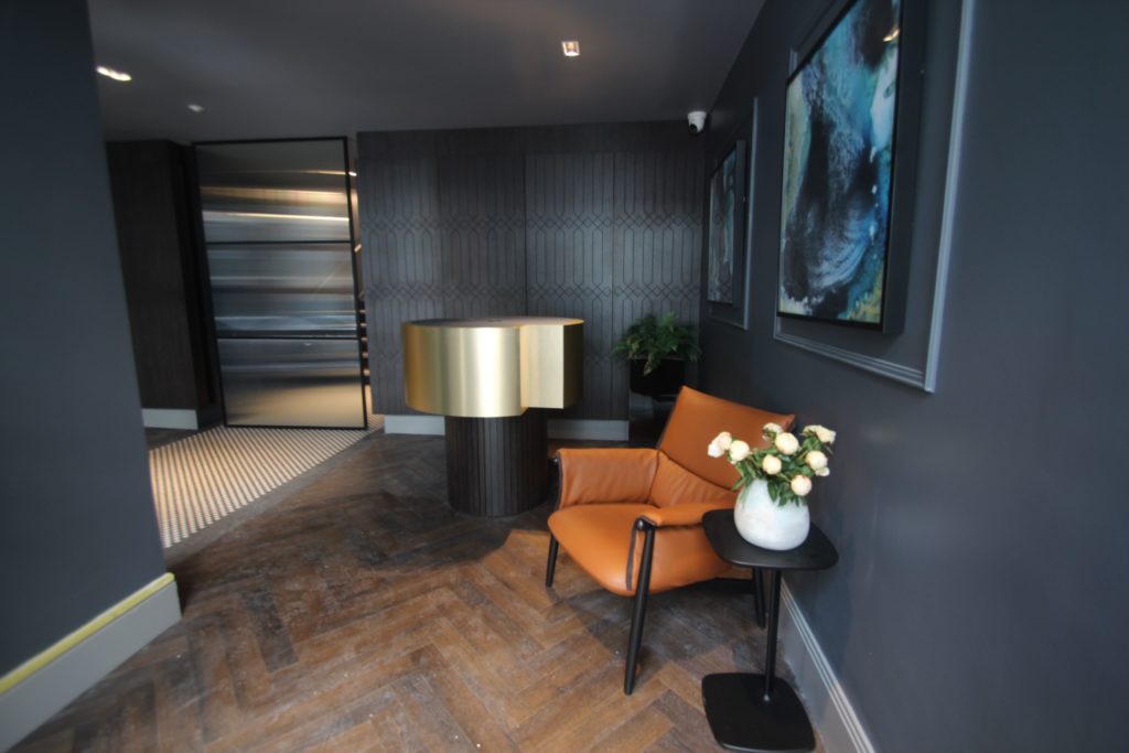 Brook House offices receive our bespoke reception counter with routered wall panels