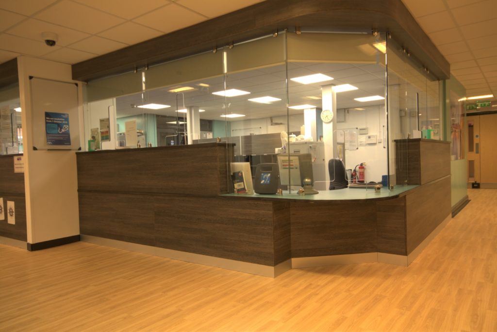 Image of a new bespoke reception counter for Longsight NHS