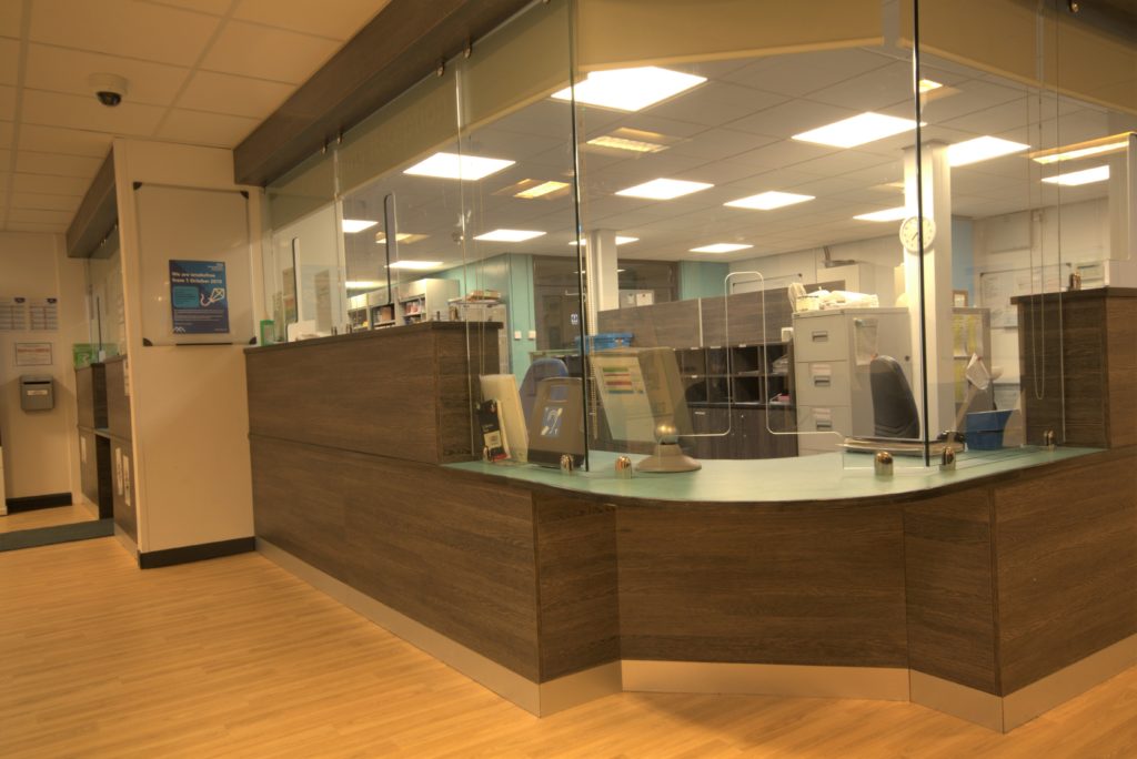 Close up image of a new bespoke reception counter for Longsight NHS